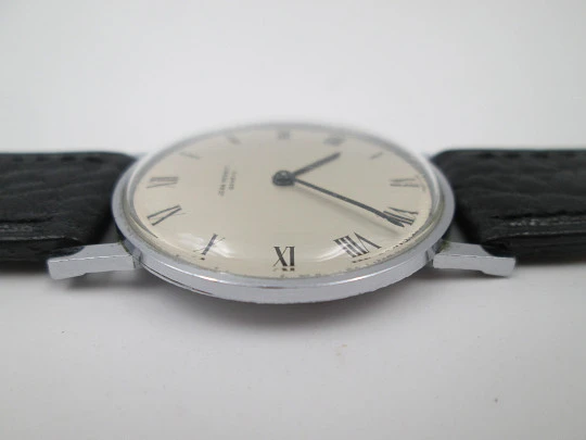 Jean Perret Genève. Steel & chromed metal. Manual winding. Leather strap. Swiss. 1960's