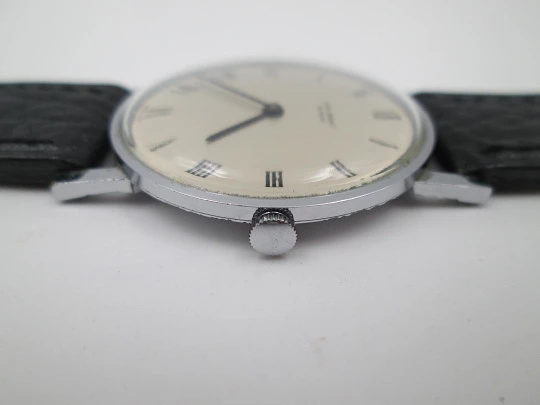 Jean Perret Genève. Steel & chromed metal. Manual winding. Leather strap. Swiss. 1960's