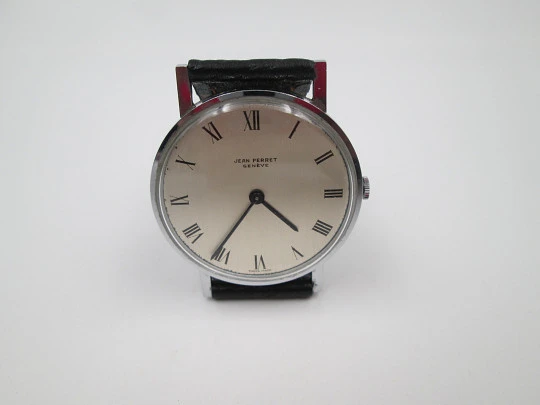 Jean Perret Genève. Steel & chromed metal. Manual winding. Leather strap. Swiss. 1960's