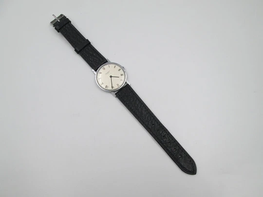 Jean Perret Genève. Steel & chromed metal. Manual winding. Leather strap. Swiss. 1960's