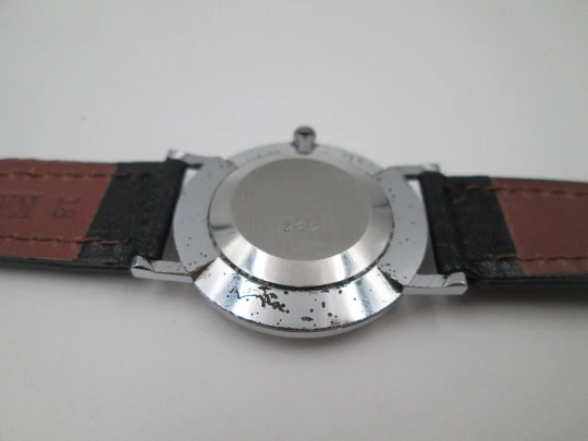 Jean Perret Genève. Steel & chromed metal. Manual winding. Leather strap. Swiss. 1960's