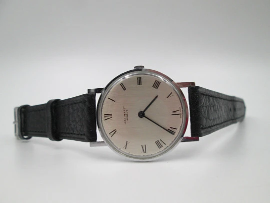 Jean Perret Genève. Steel & chromed metal. Manual winding. Leather strap. Swiss. 1960's