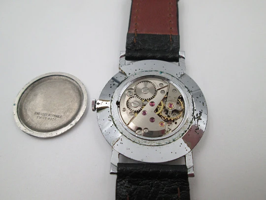 Jean Perret Genève. Steel & chromed metal. Manual winding. Leather strap. Swiss. 1960's