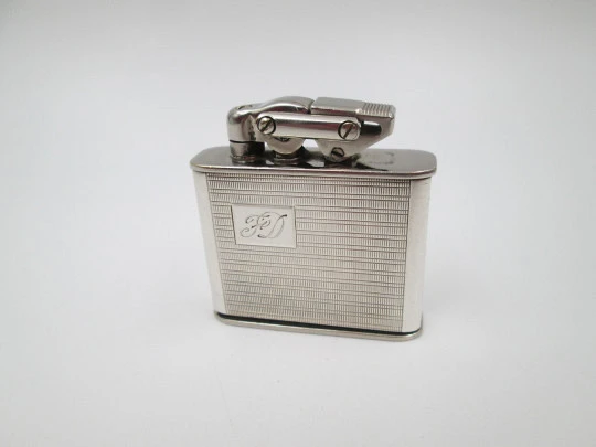 Karl Wieden 800 pocket petrol lighter. Sterling silver. Linear motifs. Germany. 1930's