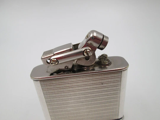 Karl Wieden 800 pocket petrol lighter. Sterling silver. Linear motifs. Germany. 1930's