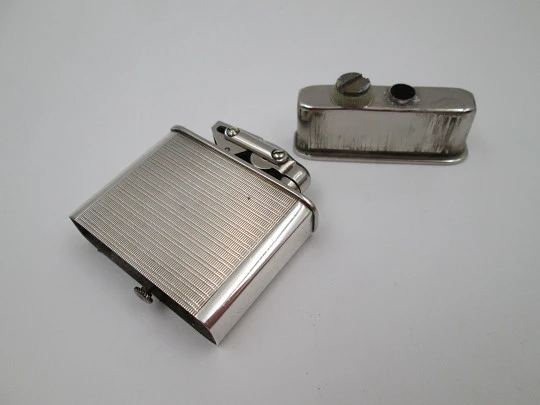 Karl Wieden 800 pocket petrol lighter. Sterling silver. Linear motifs. Germany. 1930's