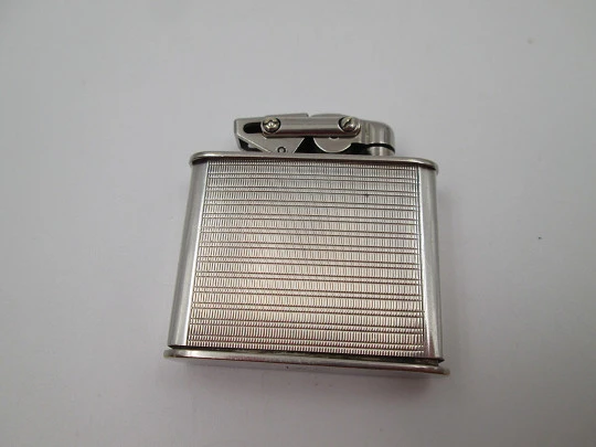 Karl Wieden 800 pocket petrol lighter. Sterling silver. Linear motifs. Germany. 1930's