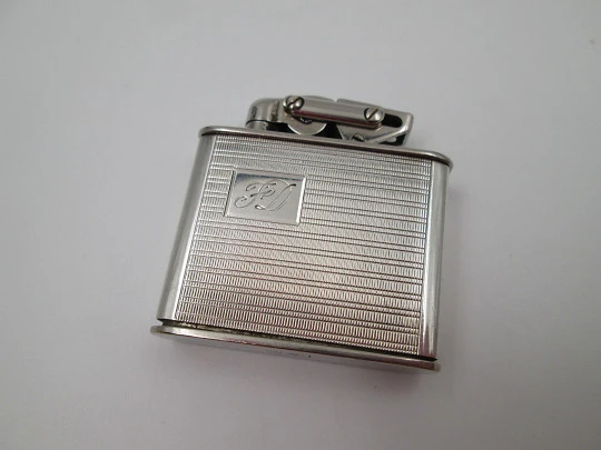 Karl Wieden 800 pocket petrol lighter. Sterling silver. Linear motifs. Germany. 1930's