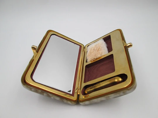 Ladie's vanity handbag. Marble celluloid and gold plated metal. United States. 1950's