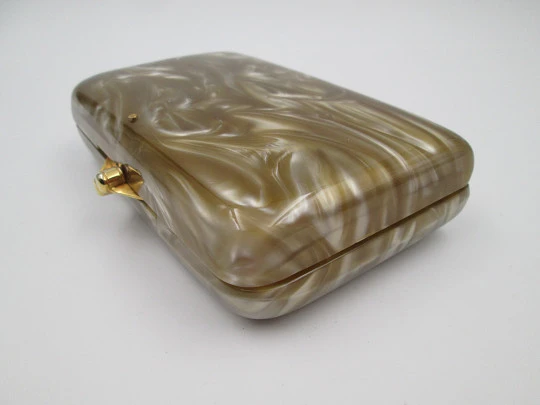 Ladie's vanity handbag. Marble celluloid and gold plated metal. United States. 1950's