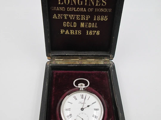 Longines open-faced pocket watch. Chromed steel. Manual wind. Wood box. 1960's. Swiss