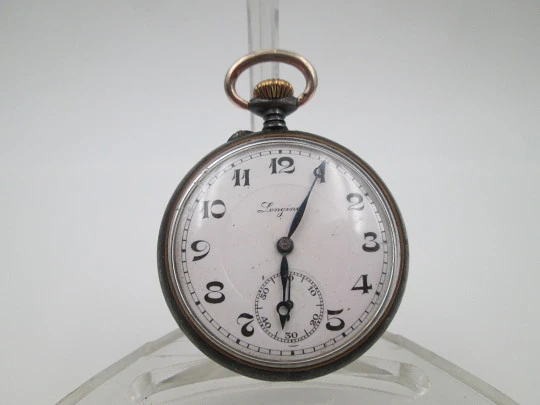 Longines open-faced pocket watch. Iron and gold plated. Stem-wind. Porcelain dial. 1890's