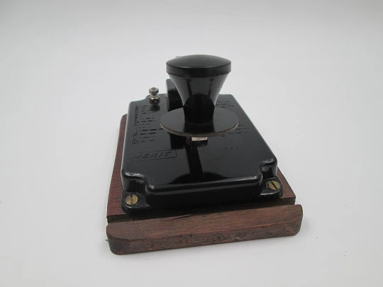 Merit morse code key with alphabet. Black bakelite and wood stand. England. 1950's