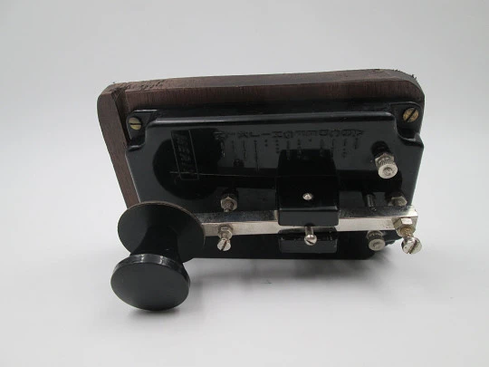 Merit morse code key with alphabet. Black bakelite and wood stand. England. 1950's