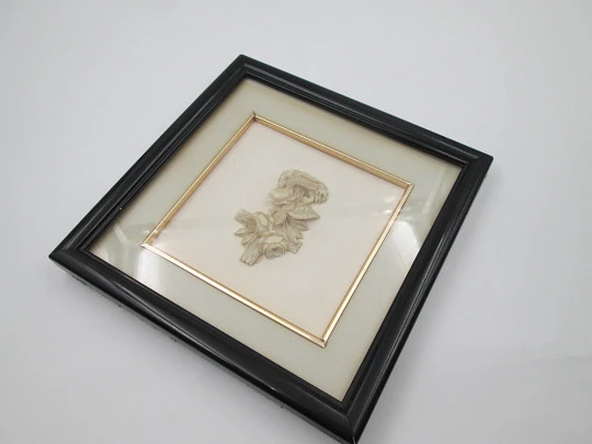 Miniature ivory openwork cross in wooden frame. Flowers, leaves and snake. 1930's