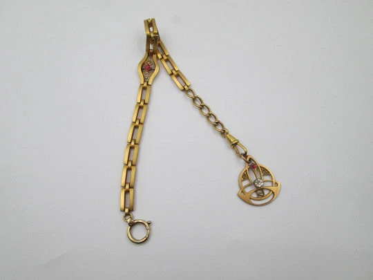 Modernist pocket watch chain with pendant. Gold plated metal and colours gems. 1920's