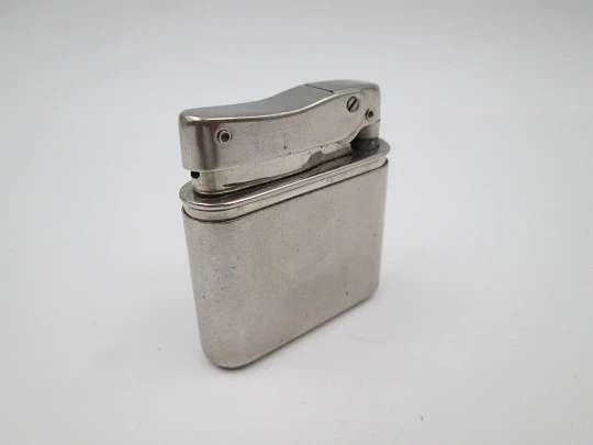 Mylflam Bob petrol pocket lighter. Silver plated metal. Europe-Africa map. Box. 1950's