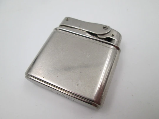 Mylflam Bob petrol pocket lighter. Silver plated metal. Europe-Africa map. Box. 1950's