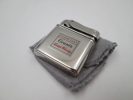 Mylflam Bob petrol pocket lighter. Silver plated metal. Whisky Grant's. West Germany. 1950's