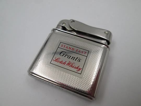 Mylflam Bob petrol pocket lighter. Silver plated metal. Whisky Grant's. West Germany. 1950's