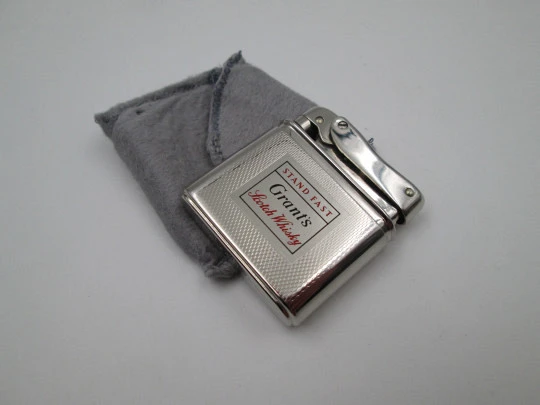 Mylflam Bob petrol pocket lighter. Silver plated metal. Whisky Grant's. West Germany. 1950's