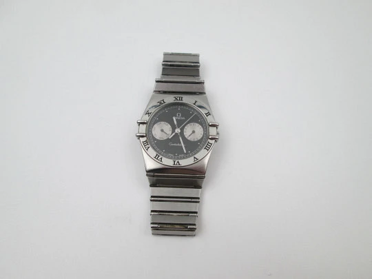 Omega Constellation. Stainless steel. Black dial. Quartz. Calendar. Bracelet. 1990's