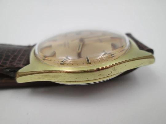 Omega Genève. 20 micron gold plated and steel. Automatic. Calendar. Strap. 1960's