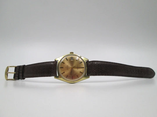 Omega Genève. 20 micron gold plated and steel. Automatic. Calendar. Strap. 1960's