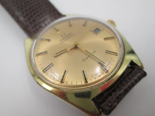 Omega Genève. 20 micron gold plated and steel. Automatic. Calendar. Strap. 1960's