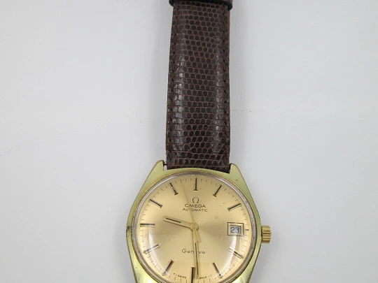 Omega Genève. 20 micron gold plated and steel. Automatic. Calendar. Strap. 1960's