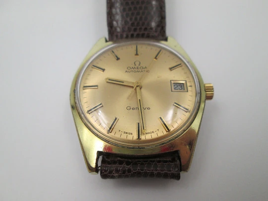 Omega Genève. 20 micron gold plated and steel. Automatic. Calendar. Strap. 1960's