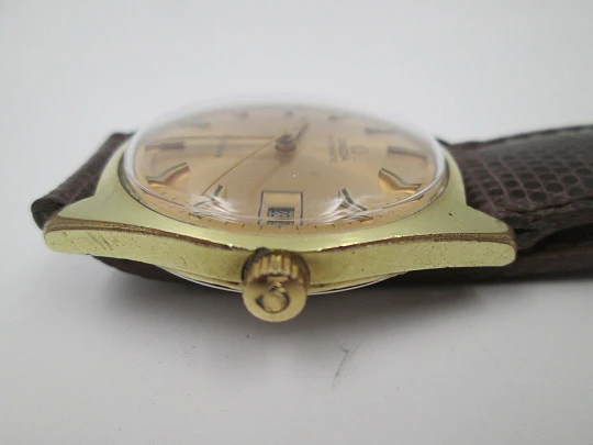 Omega Genève. 20 micron gold plated and steel. Automatic. Calendar. Strap. 1960's