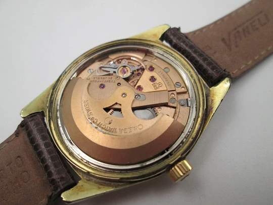 Omega Genève. 20 micron gold plated and steel. Automatic. Calendar. Strap. 1960's