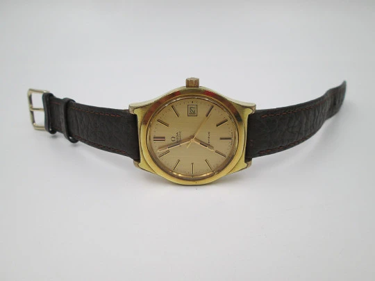 Omega Genève. 20 micron gold plated and steel. Automatic. Calendar. Strap. 1970's