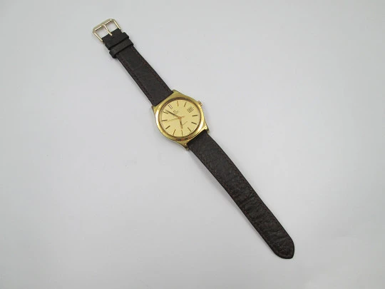 Omega Genève. 20 micron gold plated and steel. Automatic. Calendar. Strap. 1970's