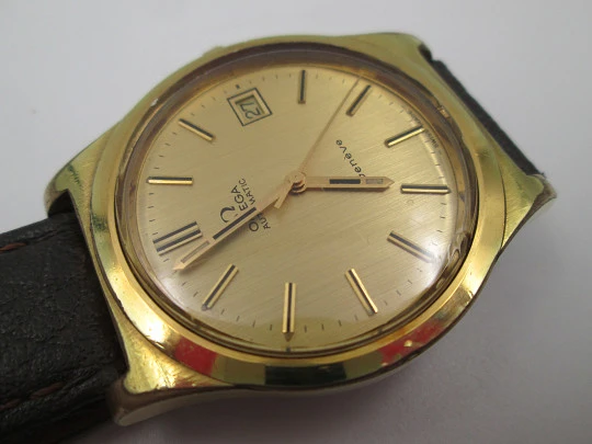 Omega Genève. 20 micron gold plated and steel. Automatic. Calendar. Strap. 1970's