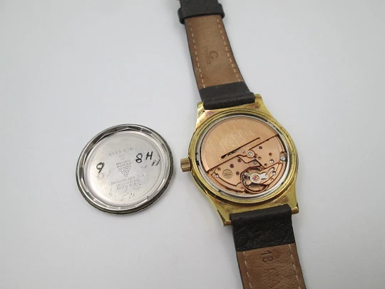 Omega Genève. 20 micron gold plated and steel. Automatic. Calendar. Strap. 1970's