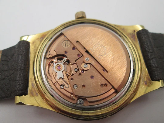 Omega Genève. 20 micron gold plated and steel. Automatic. Calendar. Strap. 1970's