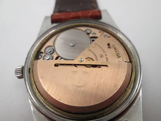 Omega Genève. Acero inoxidable. Cuerda automática. Día y fecha. Suiza. 1960