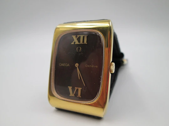 Omega Genève. Gold plated and steel. Manual wind. Tiger's eye dial. Original box. 1970's