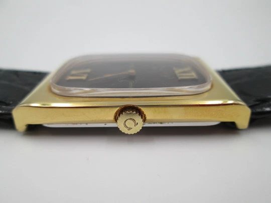 Omega Genève. Gold plated and steel. Manual wind. Tiger's eye dial. Original box. 1970's