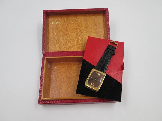 Omega Genève. Gold plated and steel. Manual wind. Tiger's eye dial. Original box. 1970's