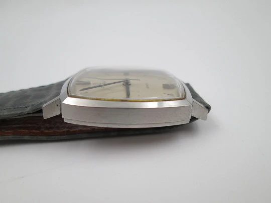 Omega Genève. Stainless steel. Manual wind. Grey dial. TV format. Leather strap. 1960's