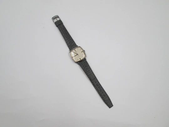 Omega Genève. Stainless steel. Manual wind. Grey dial. TV format. Leather strap. 1960's