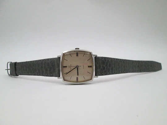 Omega Genève. Stainless steel. Manual wind. Grey dial. TV format. Leather strap. 1960's