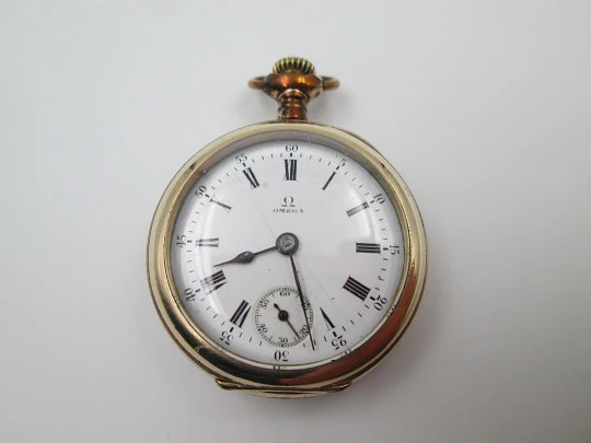 Omega open-faced pocket watch. Gold plated metal. Stem-wind. Porcelain dial. 1900's. Swiss