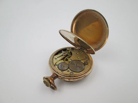 Omega open-faced pocket watch. Gold plated metal. Stem-wind. Porcelain dial. 1900's. Swiss