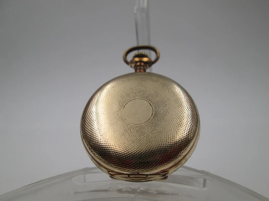 Omega open-faced pocket watch. Gold plated metal. Stem-wind. Porcelain dial. 1900's. Swiss