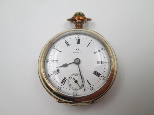 Omega open-faced pocket watch. Gold plated metal. Stem-wind. Porcelain dial. 1900's. Swiss