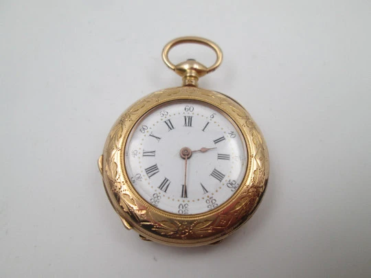 Open-face pocket watch. 14 karat yellow gold. Key-wind movement. Floral motifs. 1890's